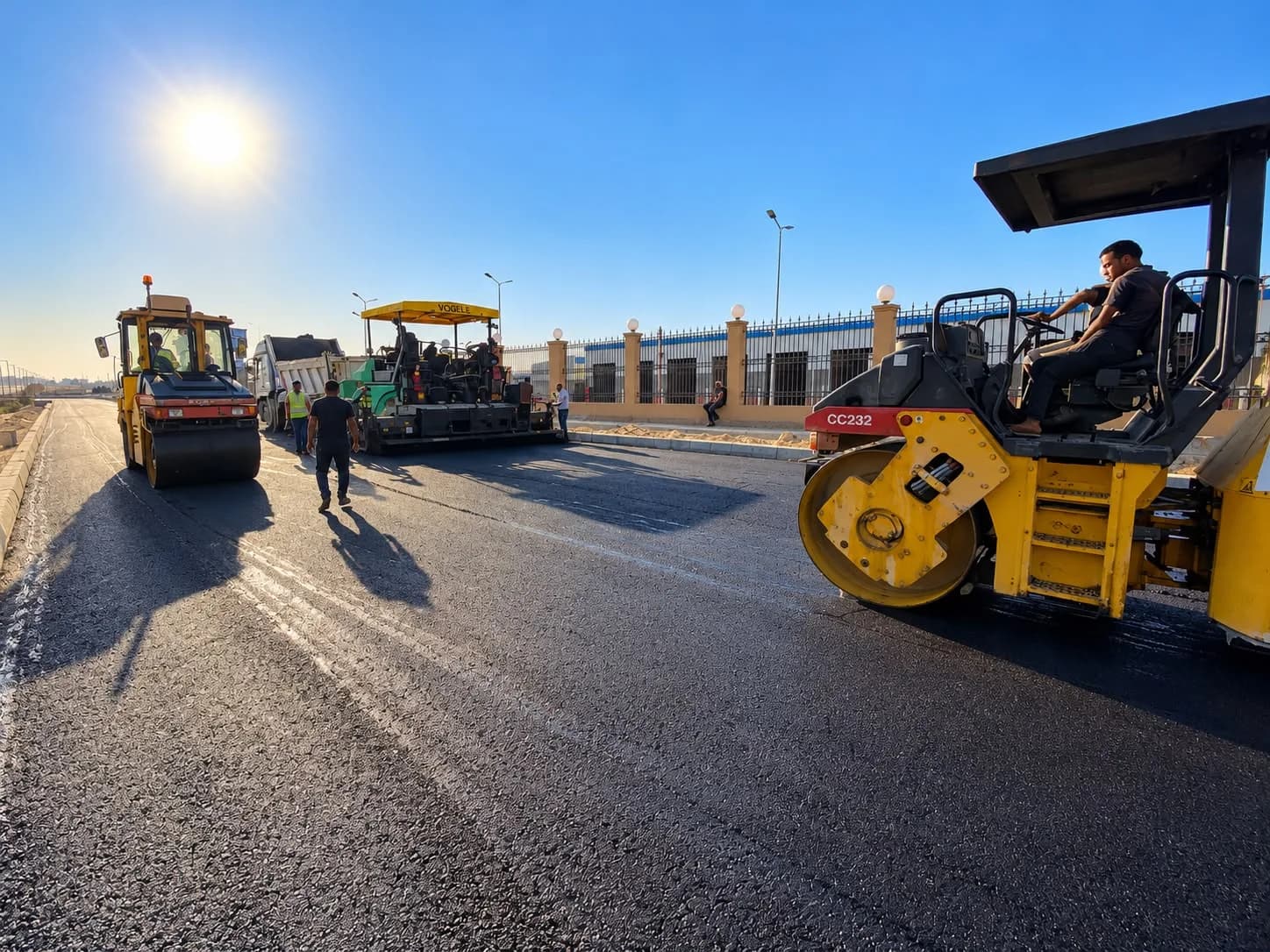Paver and rollers on site